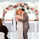 Wedding couple kissing after getting married