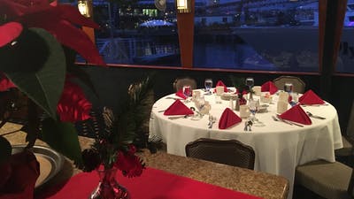 Holiday season place setting with poinsettia and red napkins