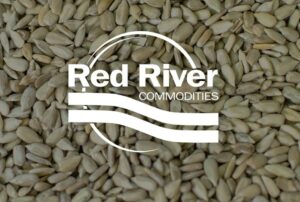 Red River Commodities logo over sunflower seeds